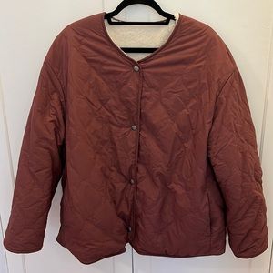 Quilted reversible fuzzy jacket.